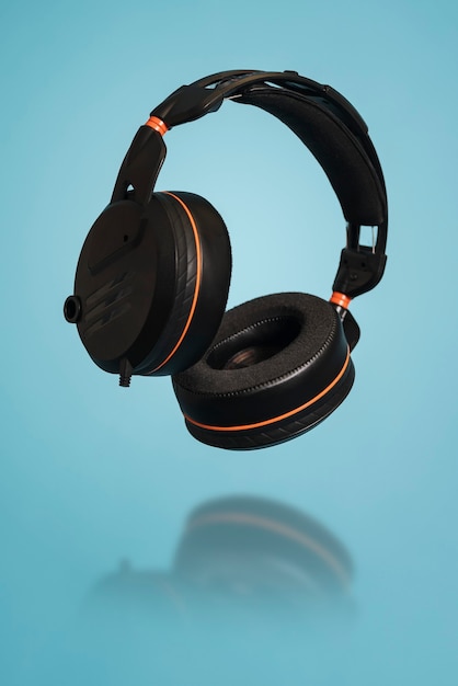 Black headphones isolated on blue background