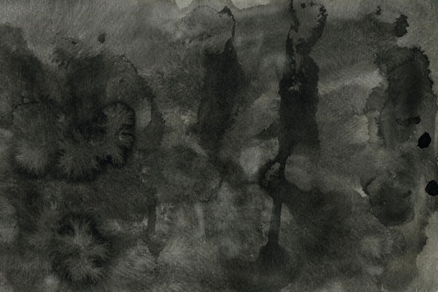 水彩紙の背景に描かれた黒インクのテクスチャ