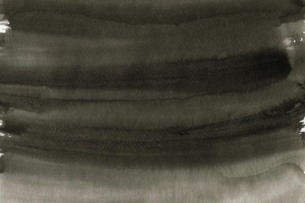 Черные чернила текстуры окрашены на фоне акварельной бумаги