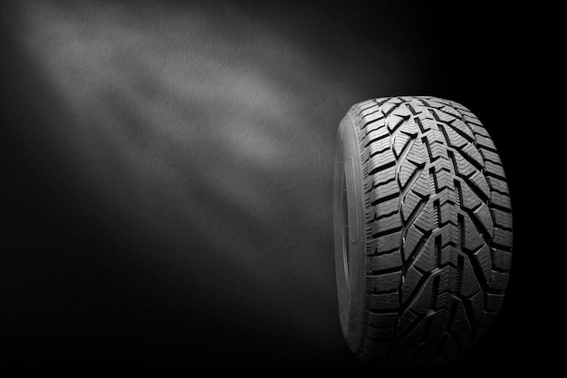 Black isolation rubber tire, on the black backgrounds