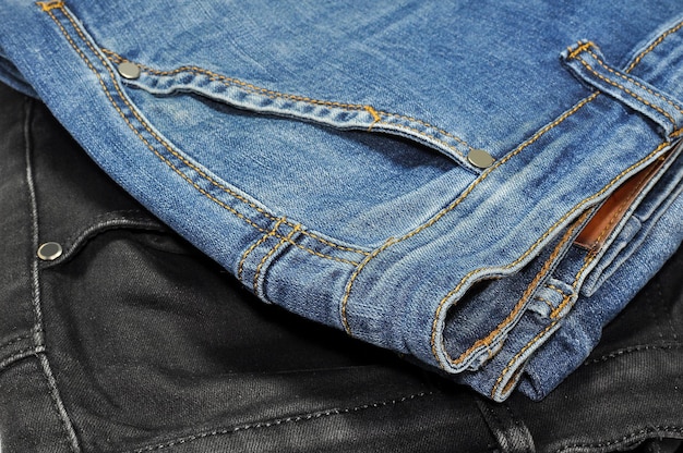 Photo black jeans pants and blue jeans pants closeup