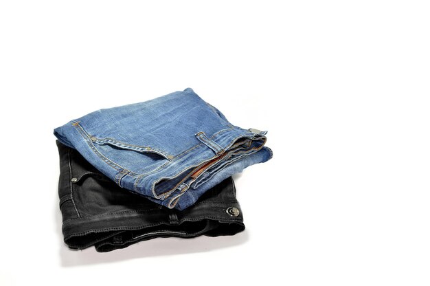 Photo black jeans pants and blue jeans pants on a white background