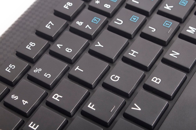 Photo black keyboard with background close up black button with illuminated characters