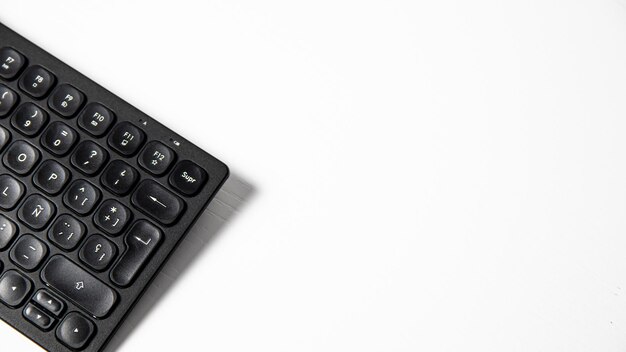 A black keyboard with a button on the top.