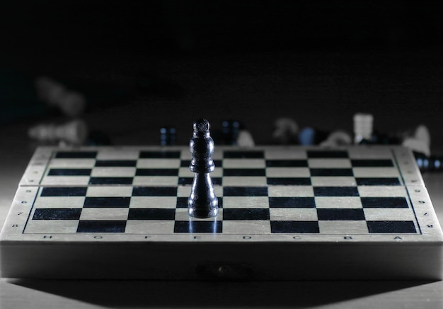 Black king on a chessboard photo with copy space