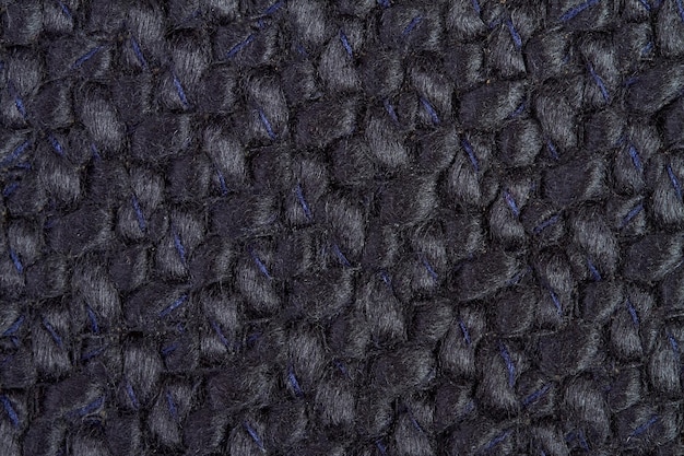 Black Knitted fabric background or texture