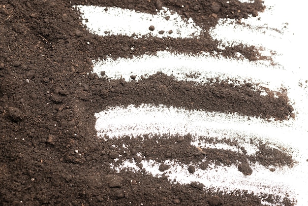 Black land for plant isolated on white background. Ground pattern.