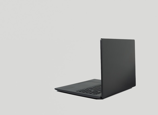 Black lap top computer with shadow isolated on grey background Copy space Working from home concept