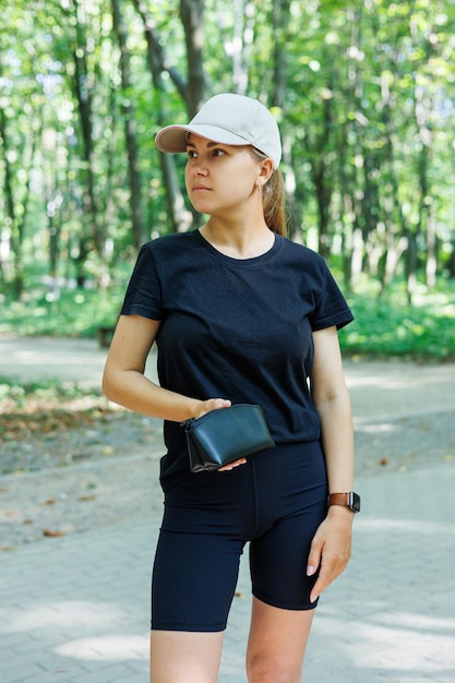 Black leather bag made of genuine leather in female hands Leather products