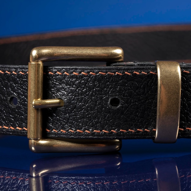 Black leather belt on a dark blue background