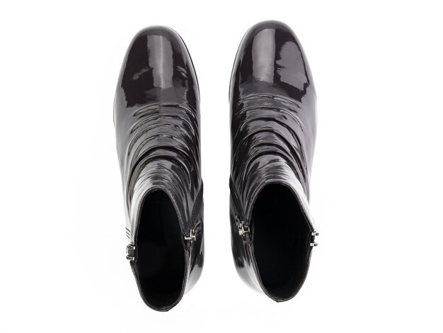 白い背景に分離された黒革のジョッパーブーツ上面図ファッション靴靴屋のコンセプトの写真撮影