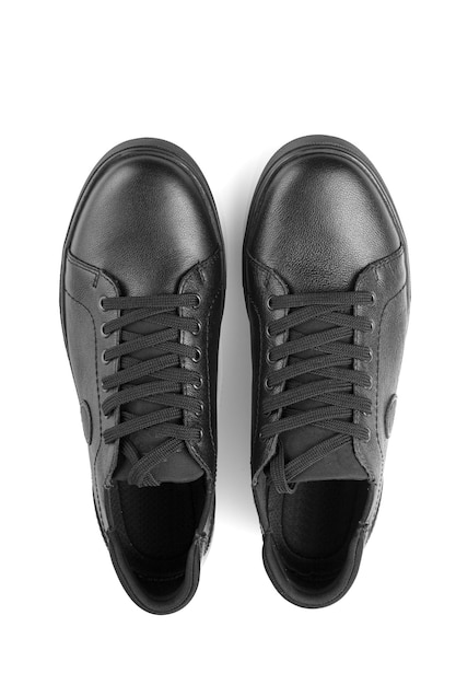 black leather sneakers on a white background closeup