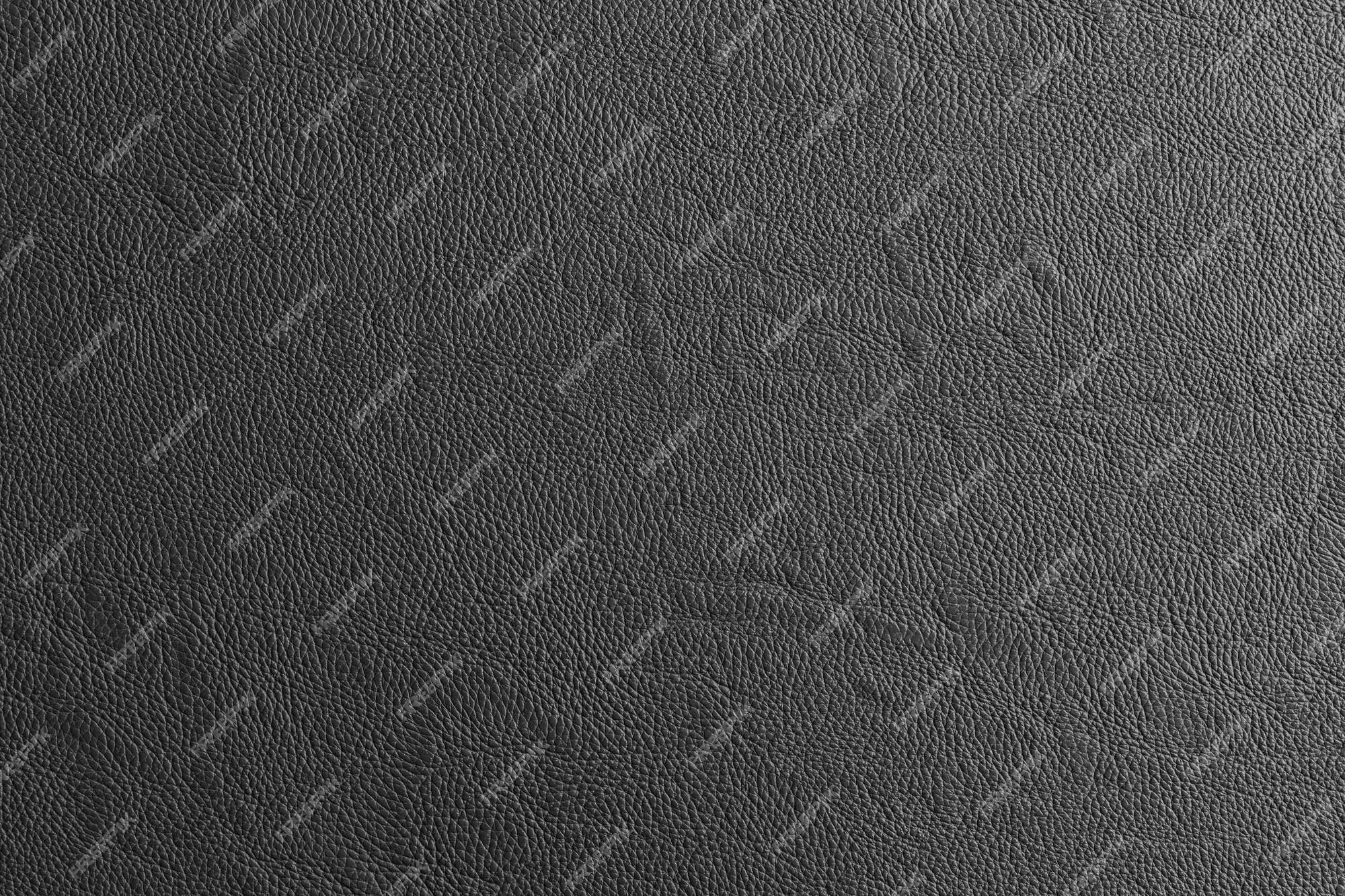 Premium Photo | Black leather and a textured background