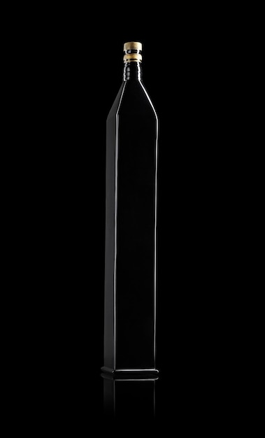 Black long bottle isolated on black background