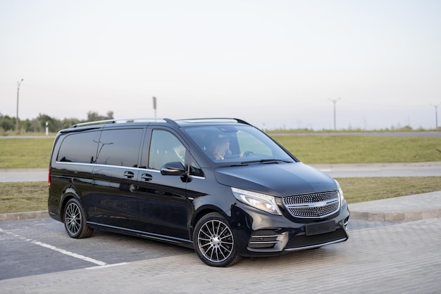 Black luxury minivan taxi