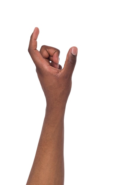 Black male hand measuring invisible items, man's palm making gesture while showing small amount of something on white isolated background