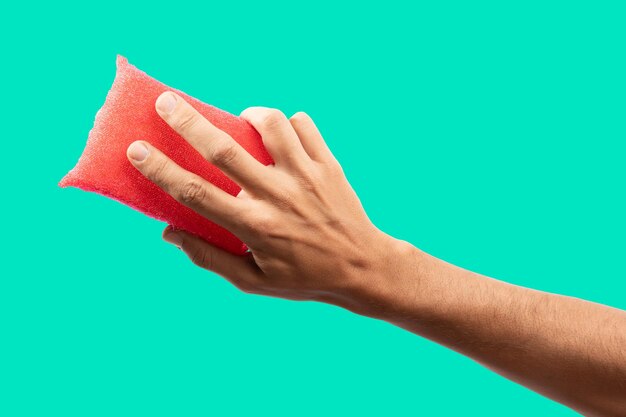 Photo black male isolated hand cleaning on a turqoise background