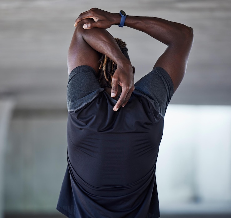 Photo black man back and stretching fitness outdoor for sports workout training warm up and runner exercise motivation african athlete arms stretch and cardio performance wellness or body muscle care