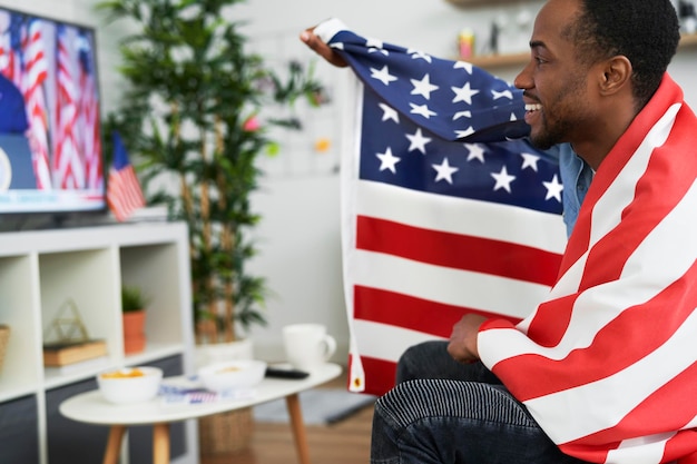 Black man cheering the candidate in election