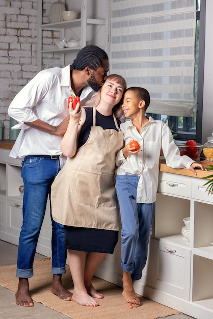 Black man cooking breakfast or lunch on kitchen at home African American man wearing an apron preparing lemon