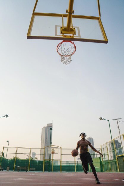 black man playing basketball game