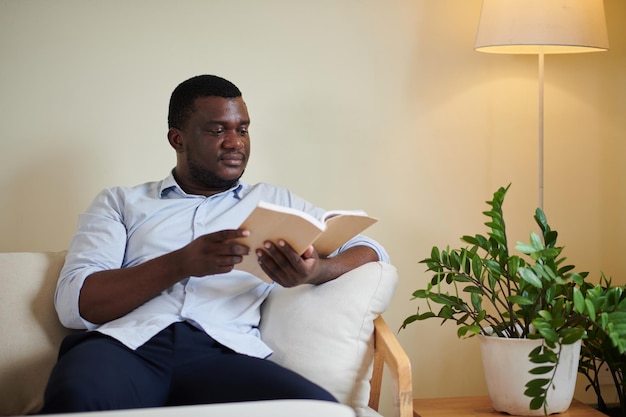 Black Man Reading Captivating Book