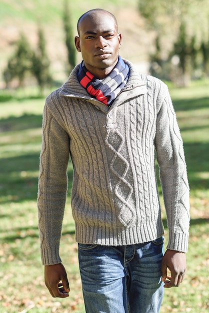 Black man wearing casual clothes in urban background