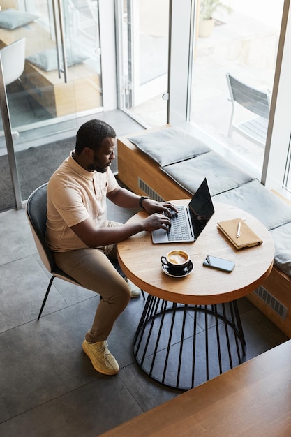 Black Man Working in Cafe