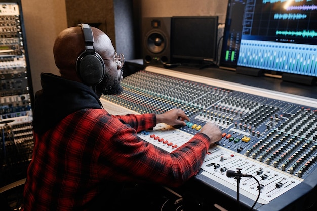 Black man working in recording studio