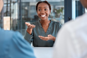 Premium Photo | Black manager advisor or coach during business meeting  while talking speaking and explaining strategy or vision in office african  american woman planning and discussing collaboration with her team