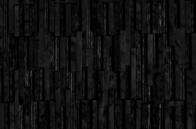 Black marble stone block wall texture background.