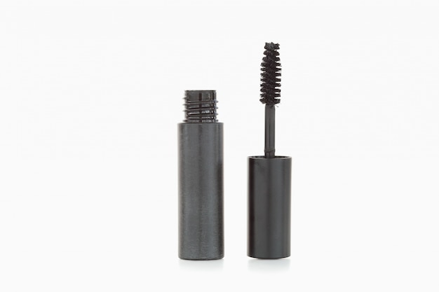 A black mascara brush and tube