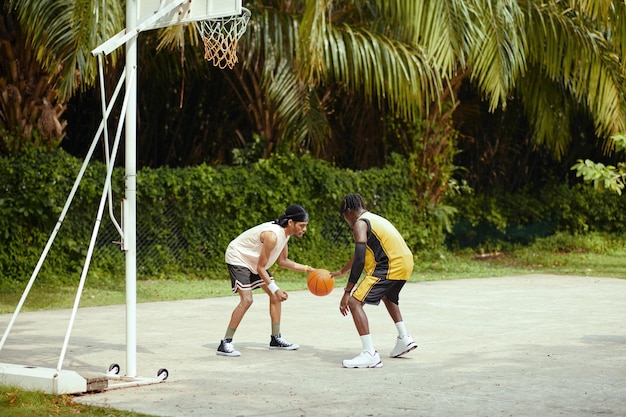 Black men playing street ball