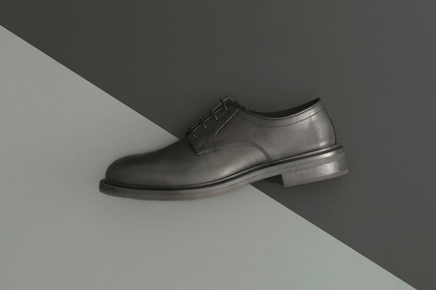 Black men's leather shoes on dark background