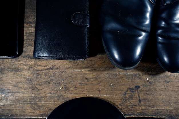 Black men's wardrobe. shoes, wallet, phone