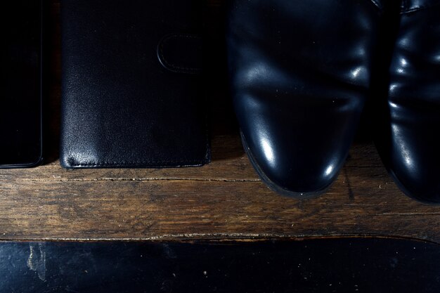 Black men's wardrobe. shoes, wallet, phone