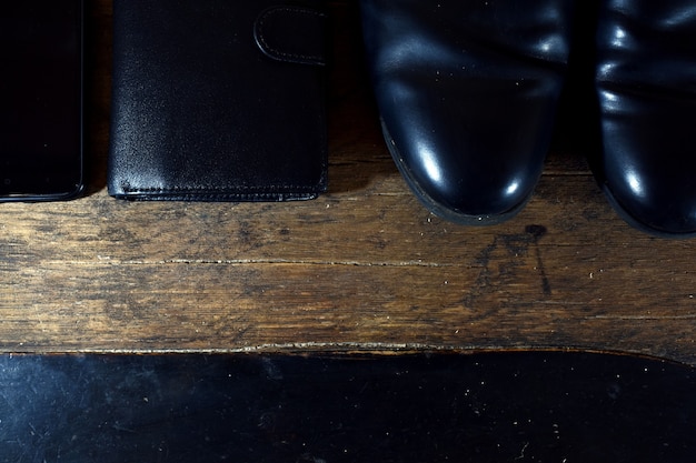 Black men's wardrobe. shoes, wallet, phone