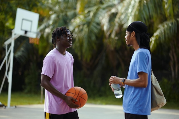 Black men talking on outdoor court