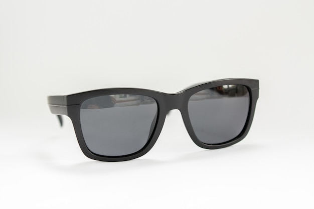 Black men39s sunglasses from a sun on a white