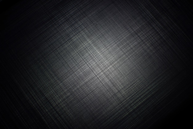 Black metal striped textured background with a light of spotlight