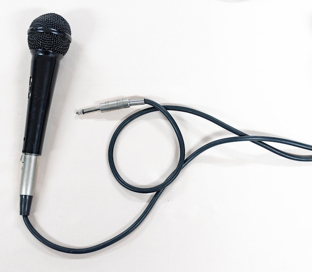 Black microphone on white background
