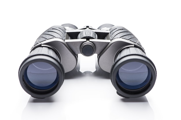 Black modern binoculars over white background