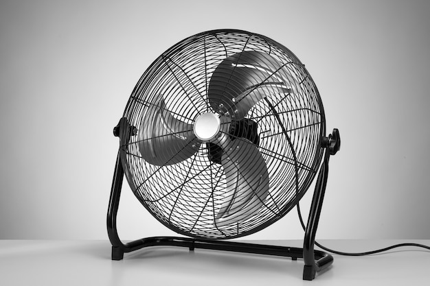 Black modern electric fan on white