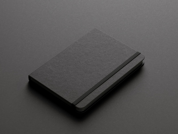 Black moleskine isolated on the black background