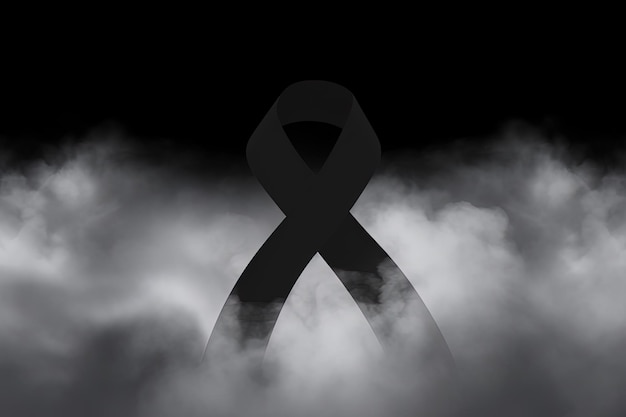 Photo black mourning ribbon with a dark smoke background