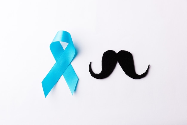 Black mustache paper and light blue ribbon, November moustache concept