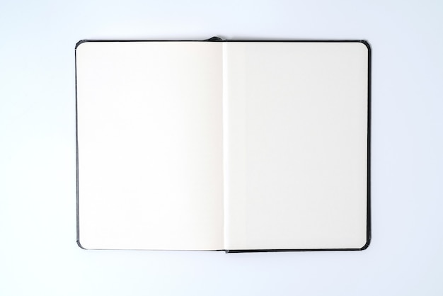 Black notebook on white background with clipping path