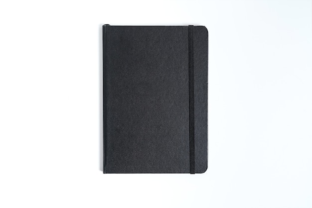 Black notebook on white background with clipping path