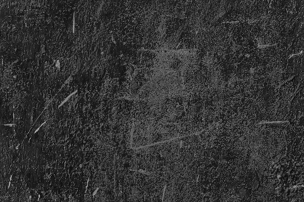 黒の古い壁のひびの入ったコンクリートの背景/抽象的な黒のテクスチャ、ヴィンテージの古い背景