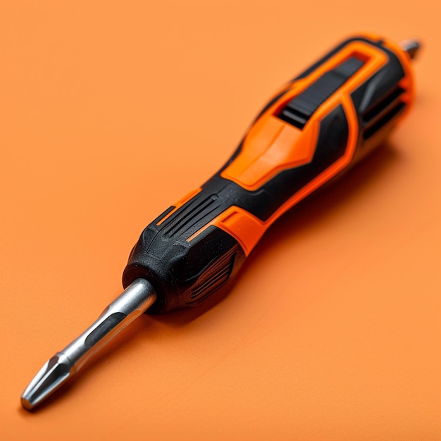 Photo a black and orange razor is on a table